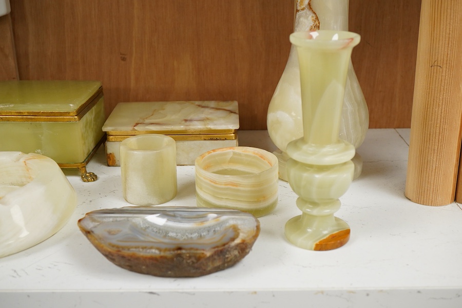 A collection of various onyx collectables to include boxes, vases and table lighters, largest 23cm high